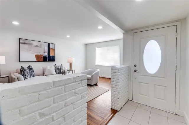 a bedroom with a large bed and a couch