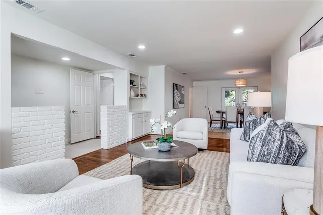a living room with furniture and a table