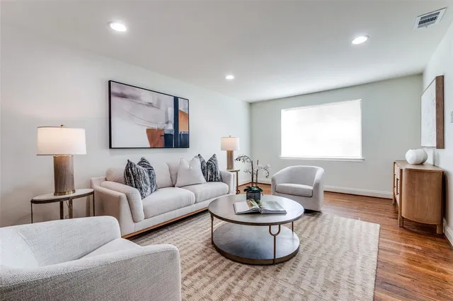 a living room with furniture and a table