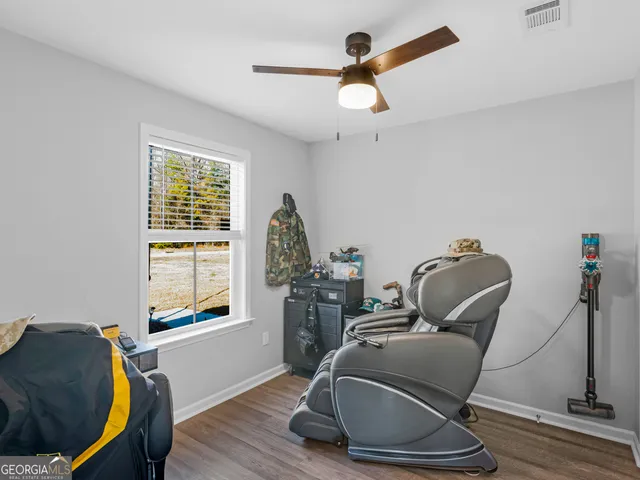 a living room with furniture and a window