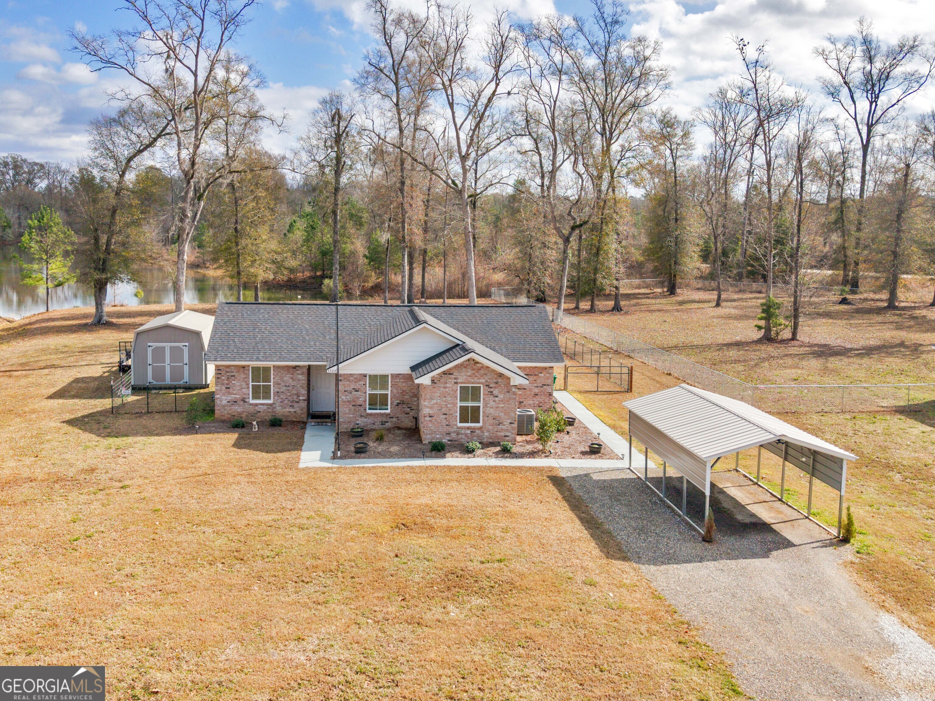 3524 Moss Island Court Albany, GA 31721 - Photo 2 of 25 a view of a house with snow on the road