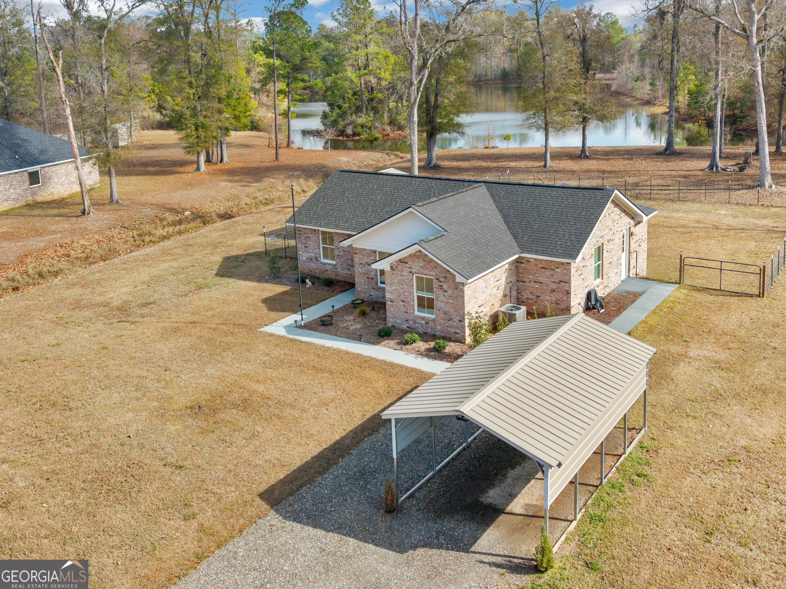 3524 Moss Island Court Albany, GA 31721 - Photo 22 of 25 a view of a patio with chairs and a table