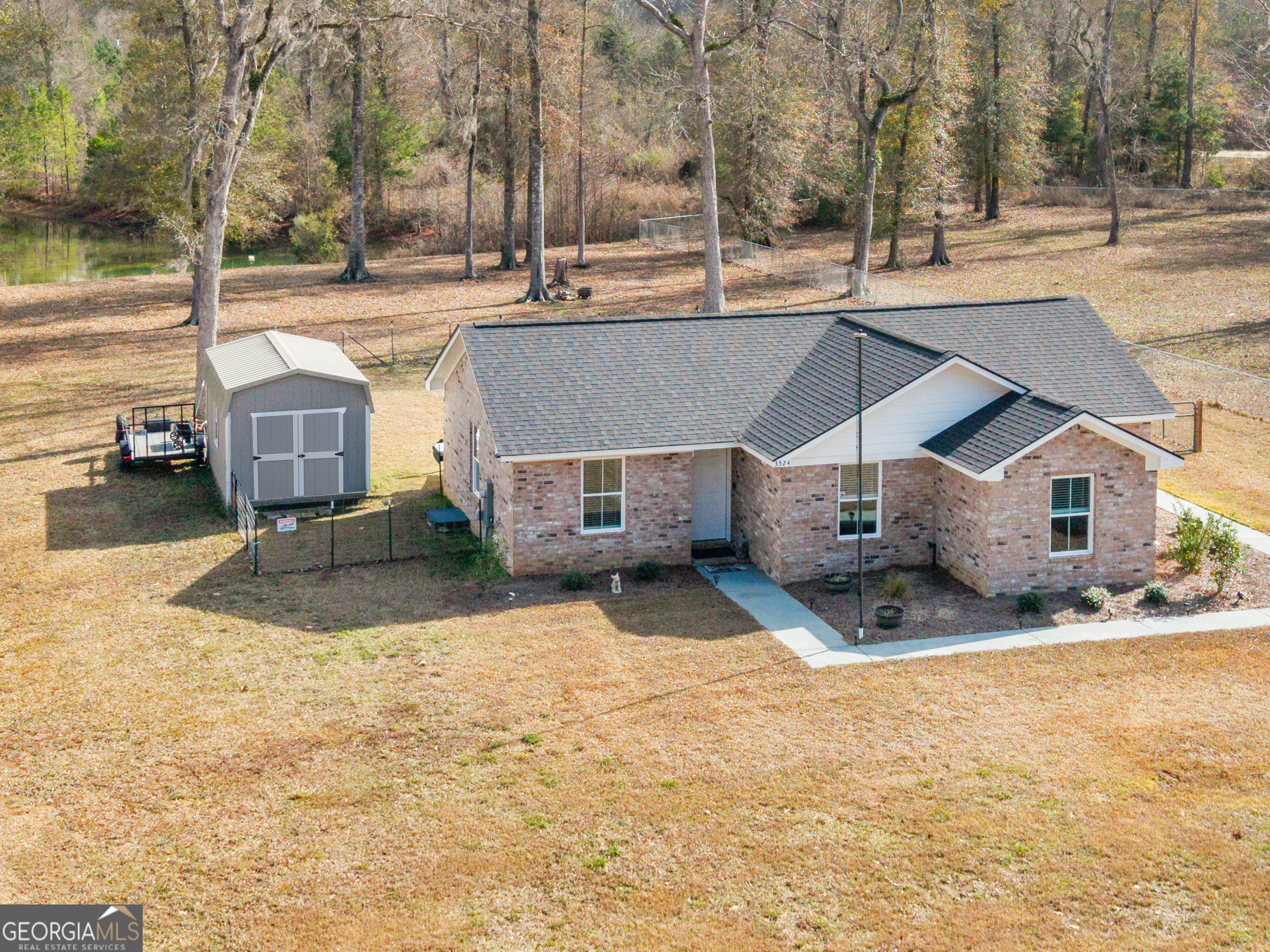 3524 Moss Island Court Albany, GA 31721 - Photo 23 of 25 a view of a house with a yard and large trees