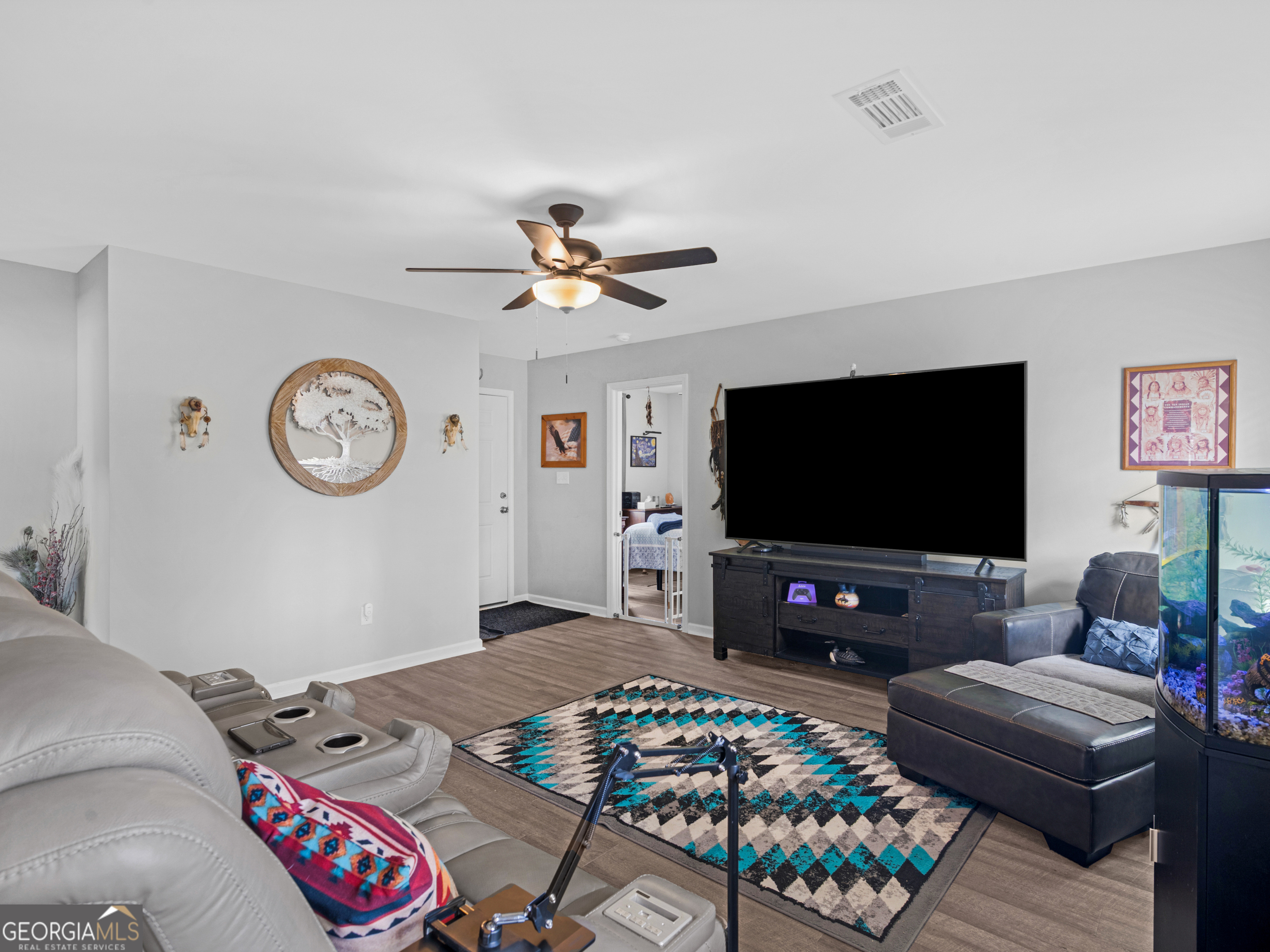 3524 Moss Island Court Albany, GA 31721 - Photo 5 of 25 a living room with furniture and a flat screen tv
