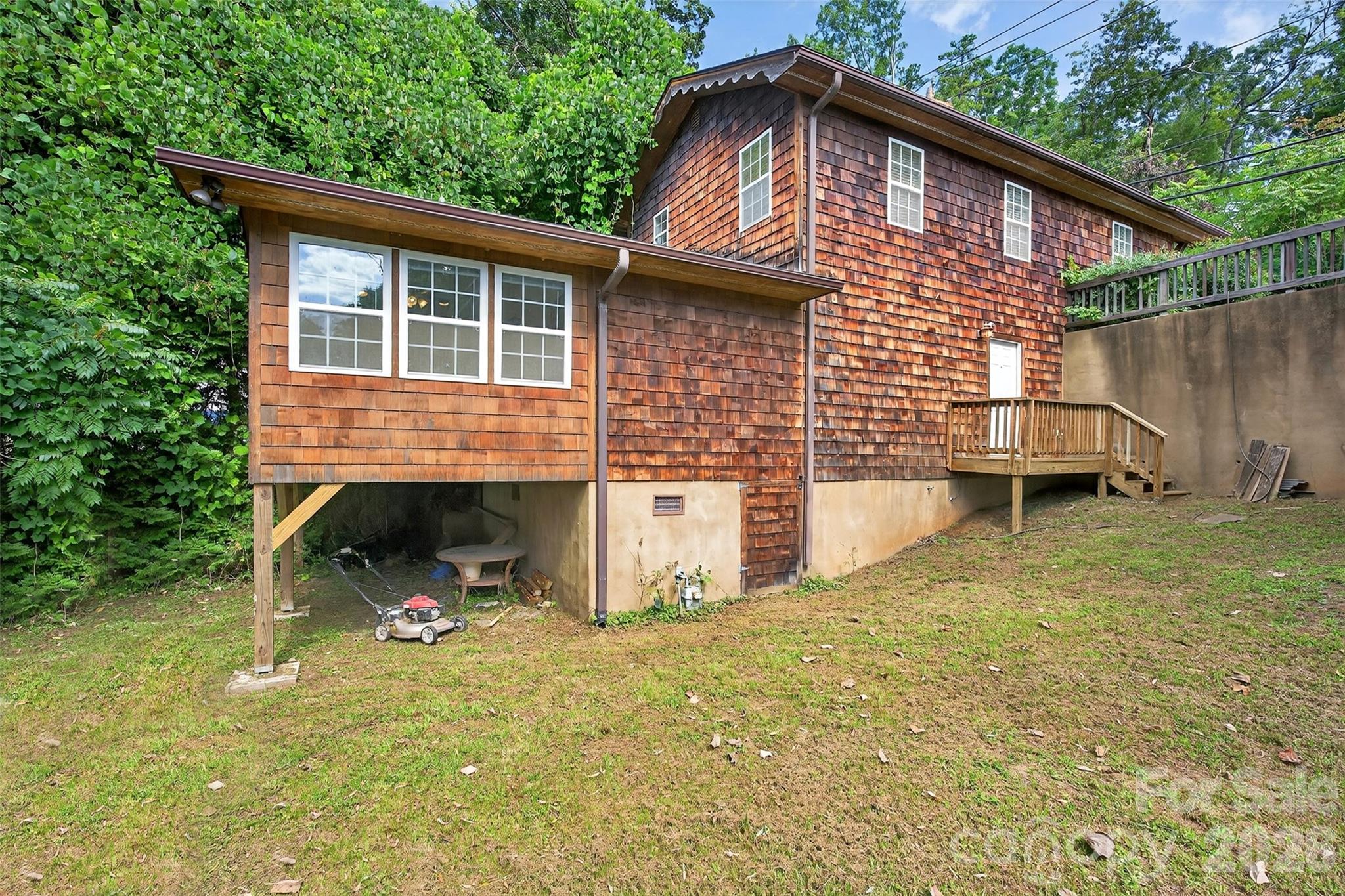 160 East Howard Street Tryon, NC 28782 - Photo 37 of 48 a front view of a house with garden
