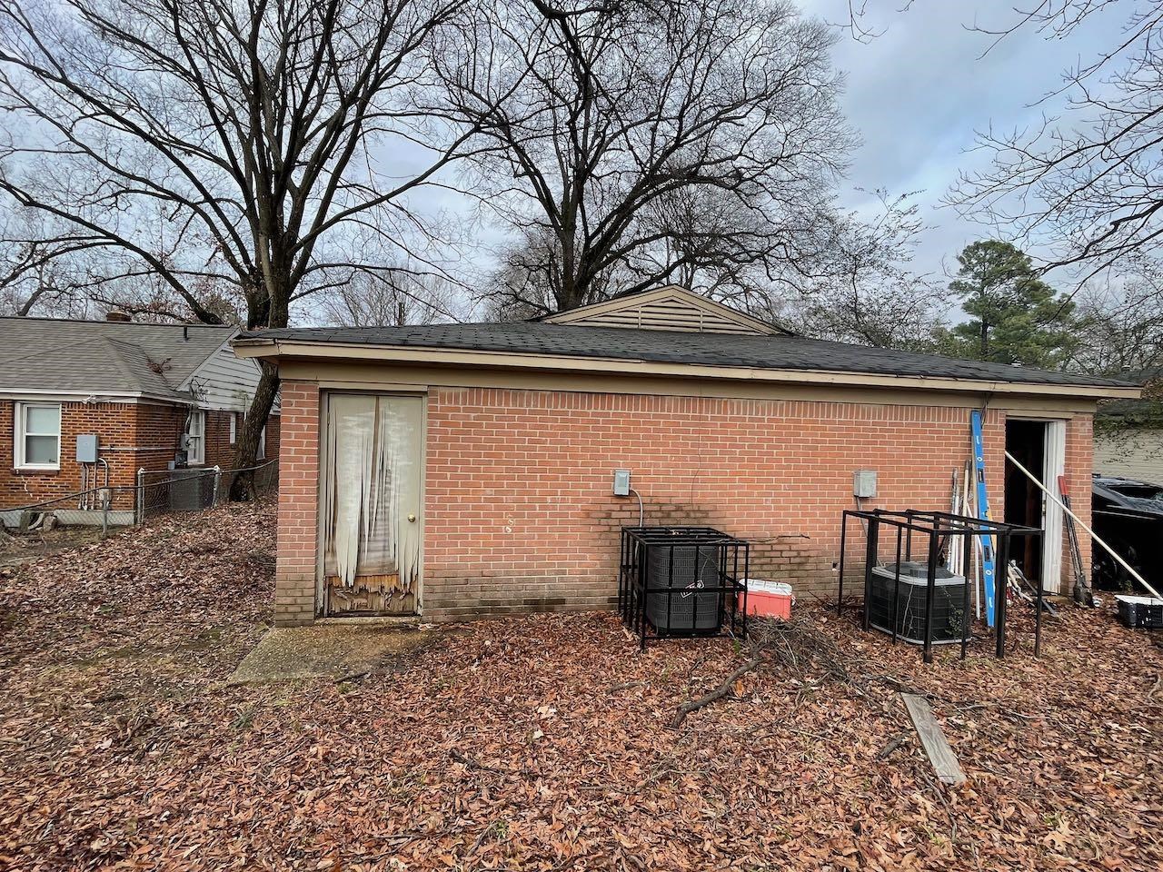 3523 Vanuys Road Memphis, TN 38111 - Photo 4 of 12 a backyard of a house with barbeque oven table and chairs