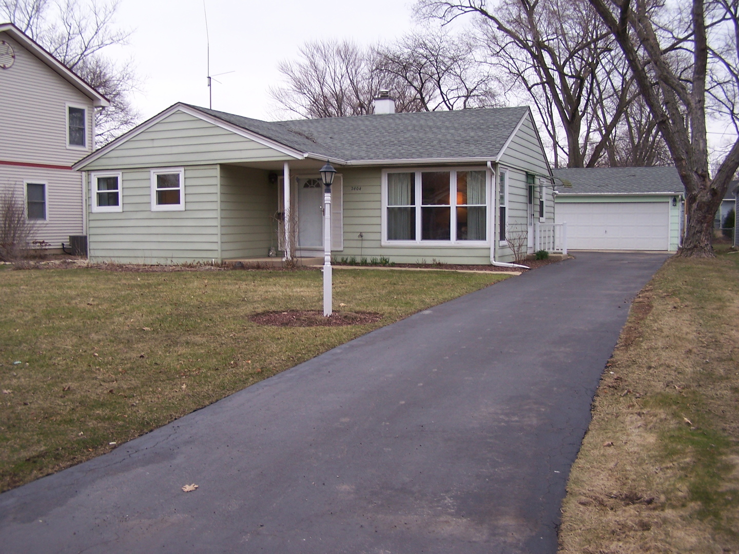 2404 School Drive Rolling Meadows, IL 60008 - Photo 2 of 14 a front view of a house with a yard and garage