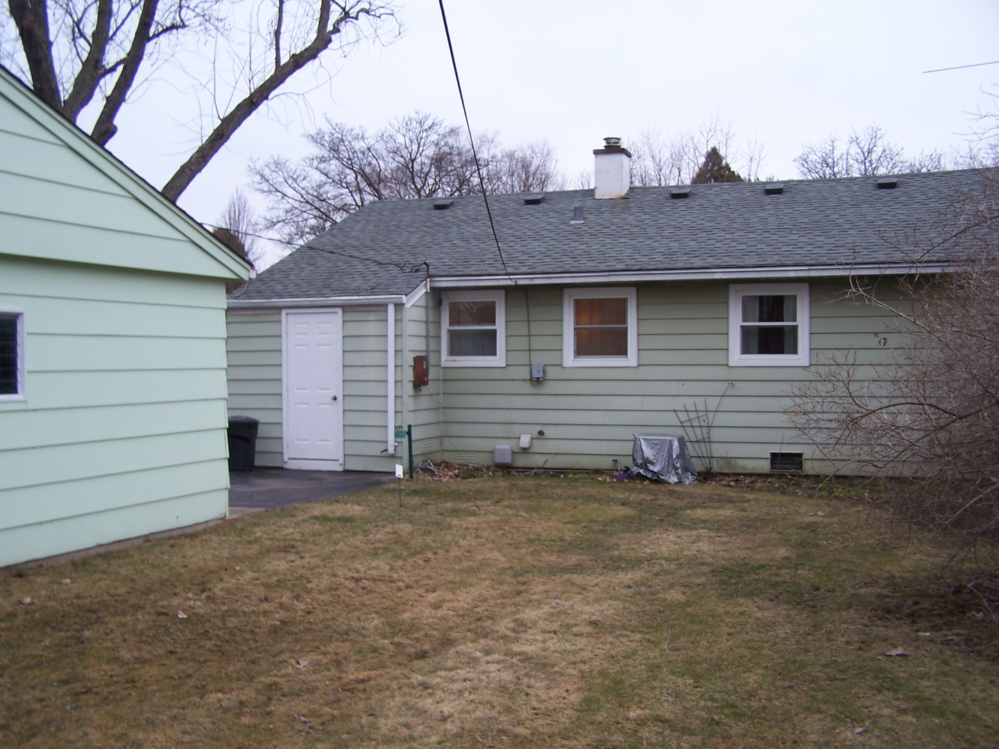2404 School Drive Rolling Meadows, IL 60008 - Photo 4 of 14 a view of a house with a backyard