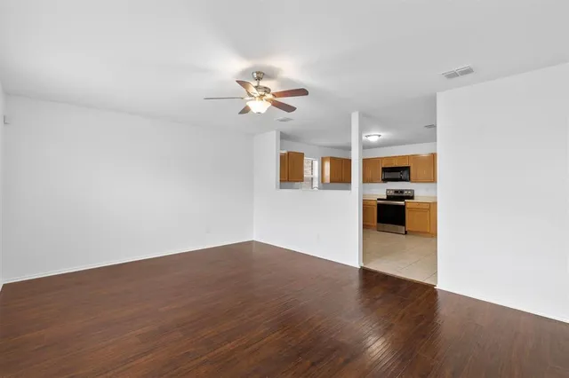 a view of a kitchen with a sink and a stove