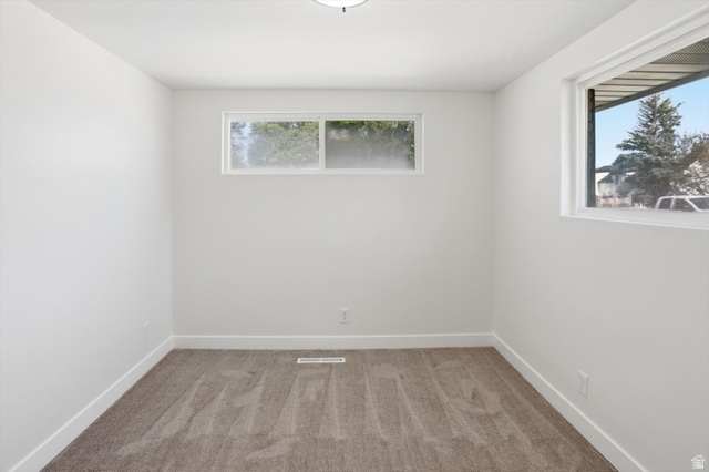 810 East Maple Street Mapleton, UT 84664 - Photo 21 of 49 Neutral-toned carpeting enhances this bright room with multiple windows, clean white walls, and matching baseboards