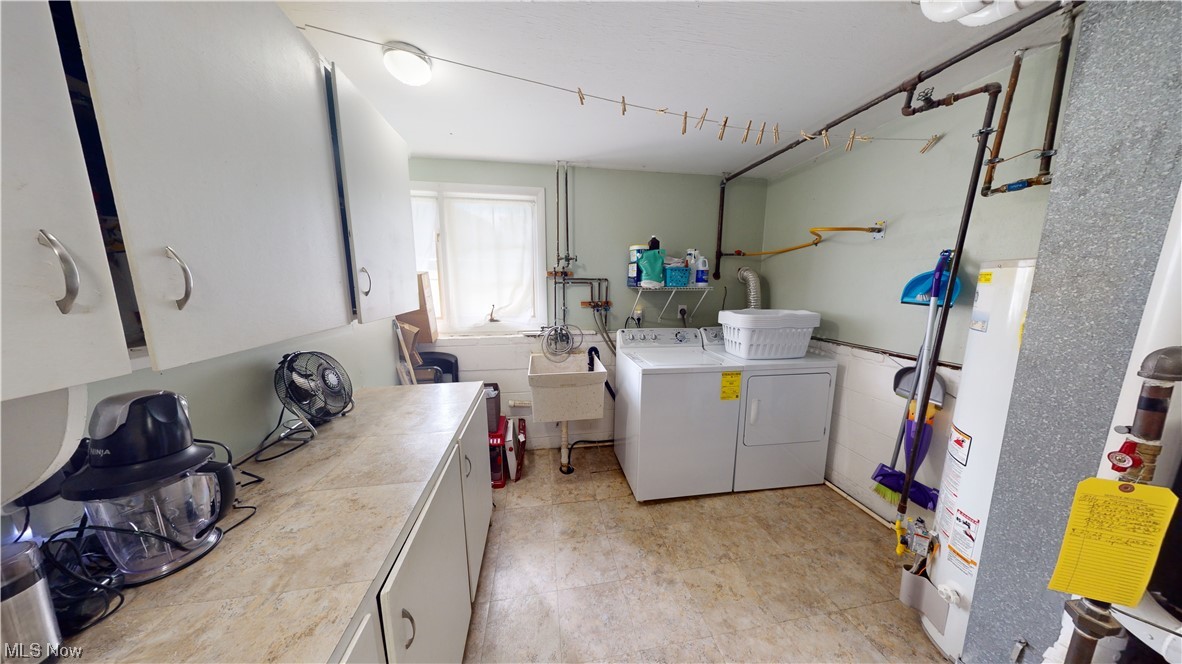 1071 Roland Road Lyndhurst, OH 44124 - Photo 13 of 30 Washroom featuring washer and dryer and light tile floors