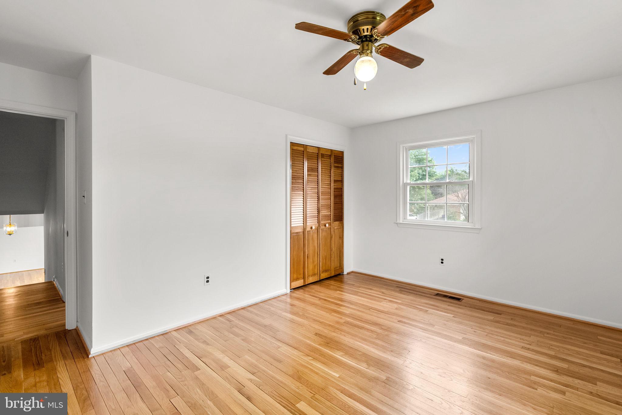 18724 Bloomfield Road Olney, MD 20832 - Photo 15 of 32 wooden floor in an empty room with a window