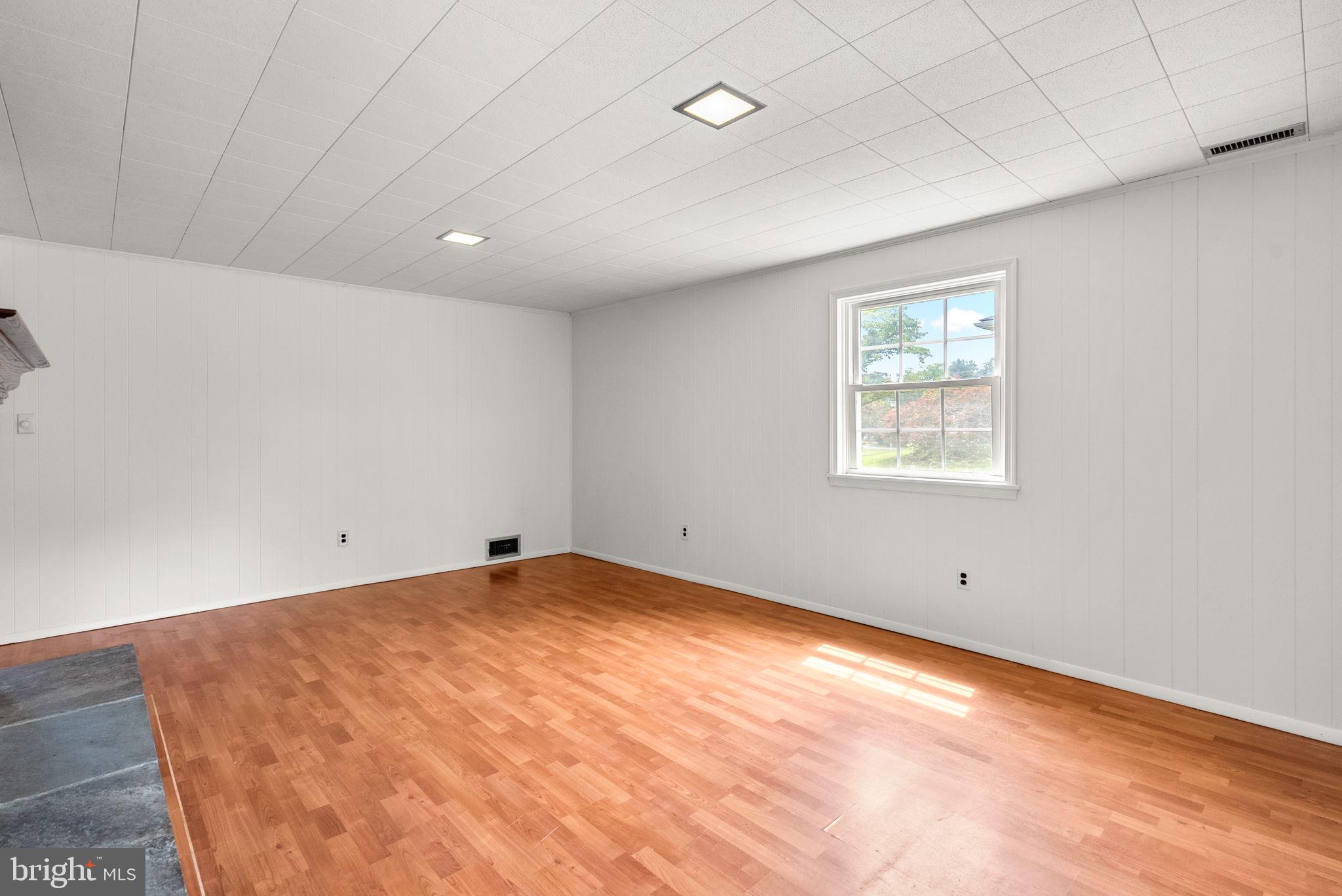 18724 Bloomfield Road Olney, MD 20832 - Photo 22 of 32 a view of an empty room with a window