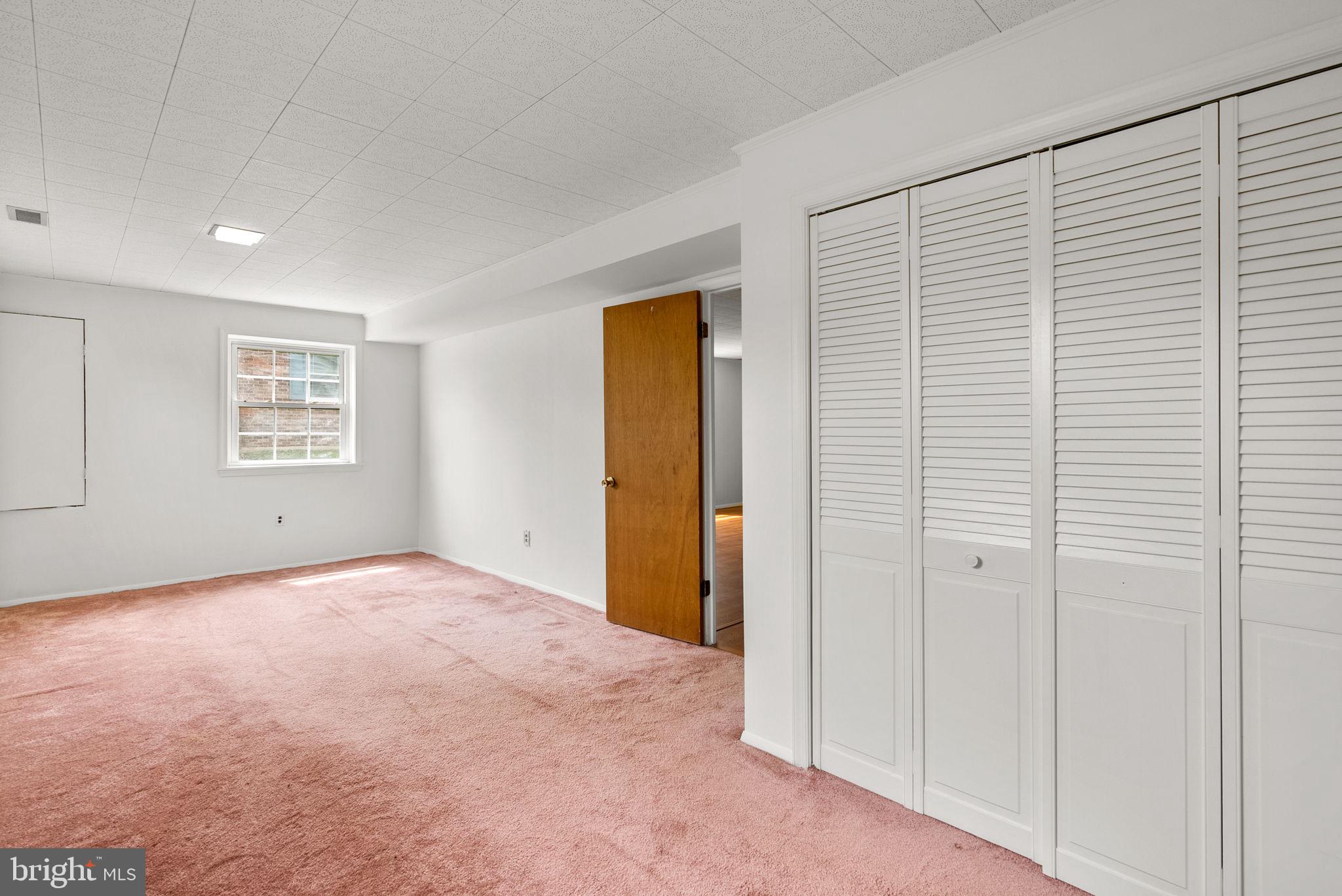 18724 Bloomfield Road Olney, MD 20832 - Photo 25 of 32 an empty room with windows and closet