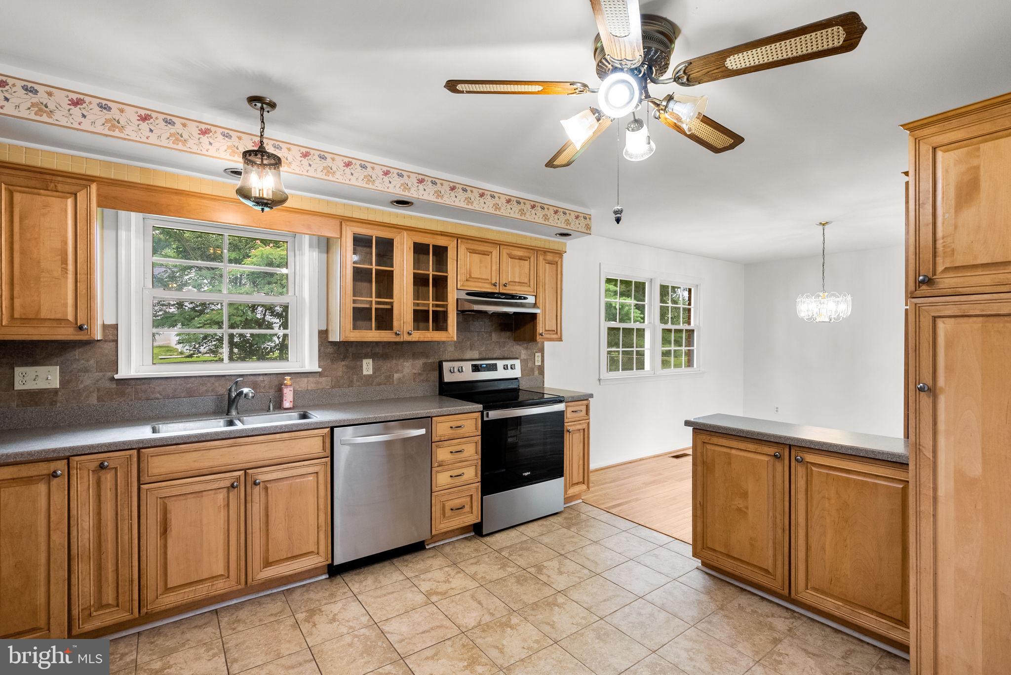 18724 Bloomfield Road Olney, MD 20832 - Photo 8 of 32 a kitchen with a stove sink and microwave