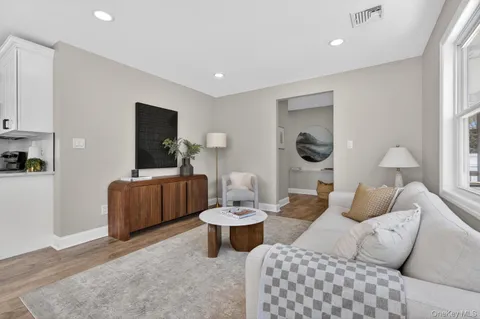 a living room with furniture and a table
