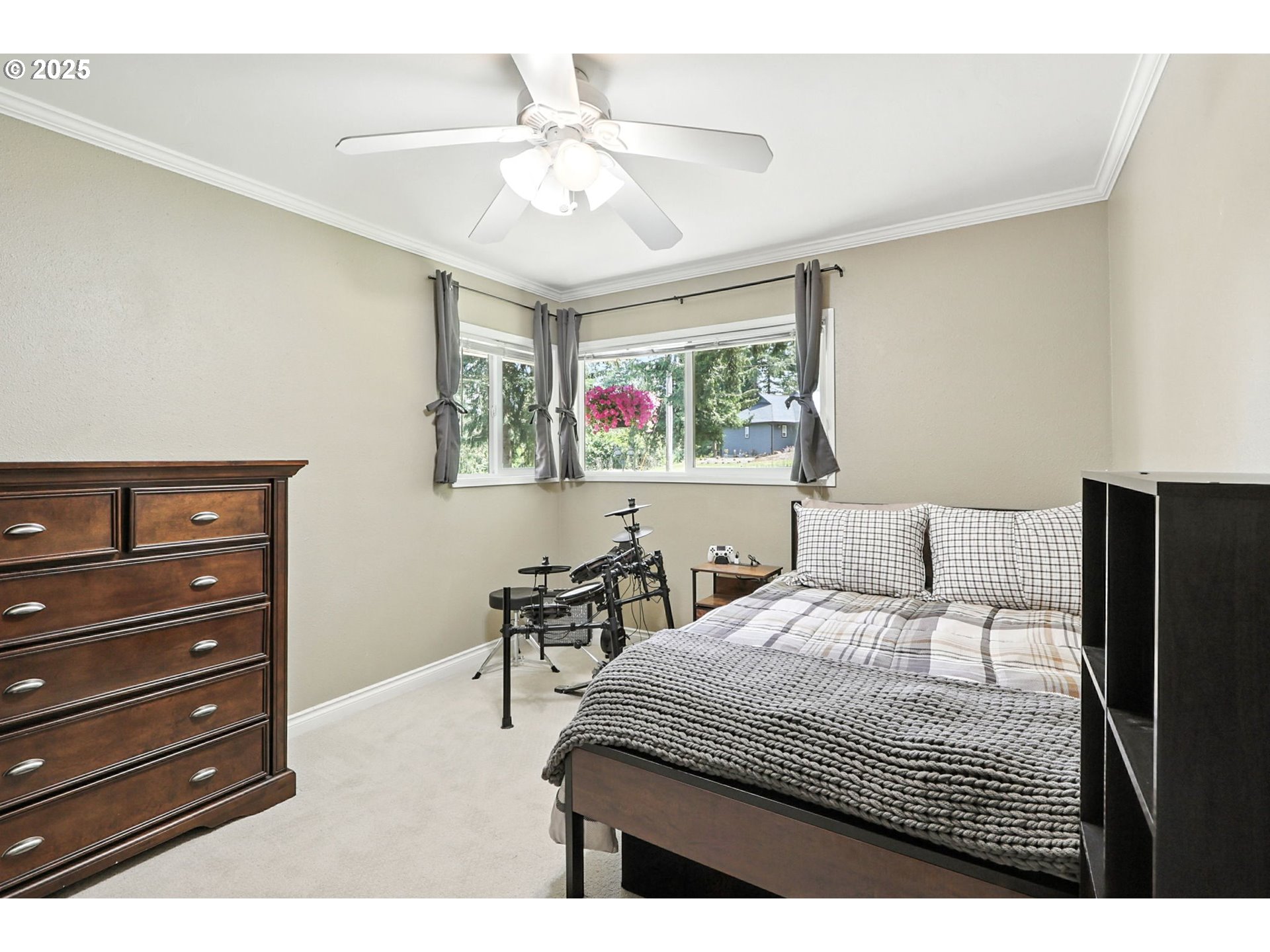 30083 Southeast Cemetery Road Estacada, OR 97023 - Photo 17 of 28 a bedroom with a bed a dresser and a chandelier