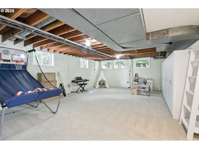 a view of a room with table and chairs