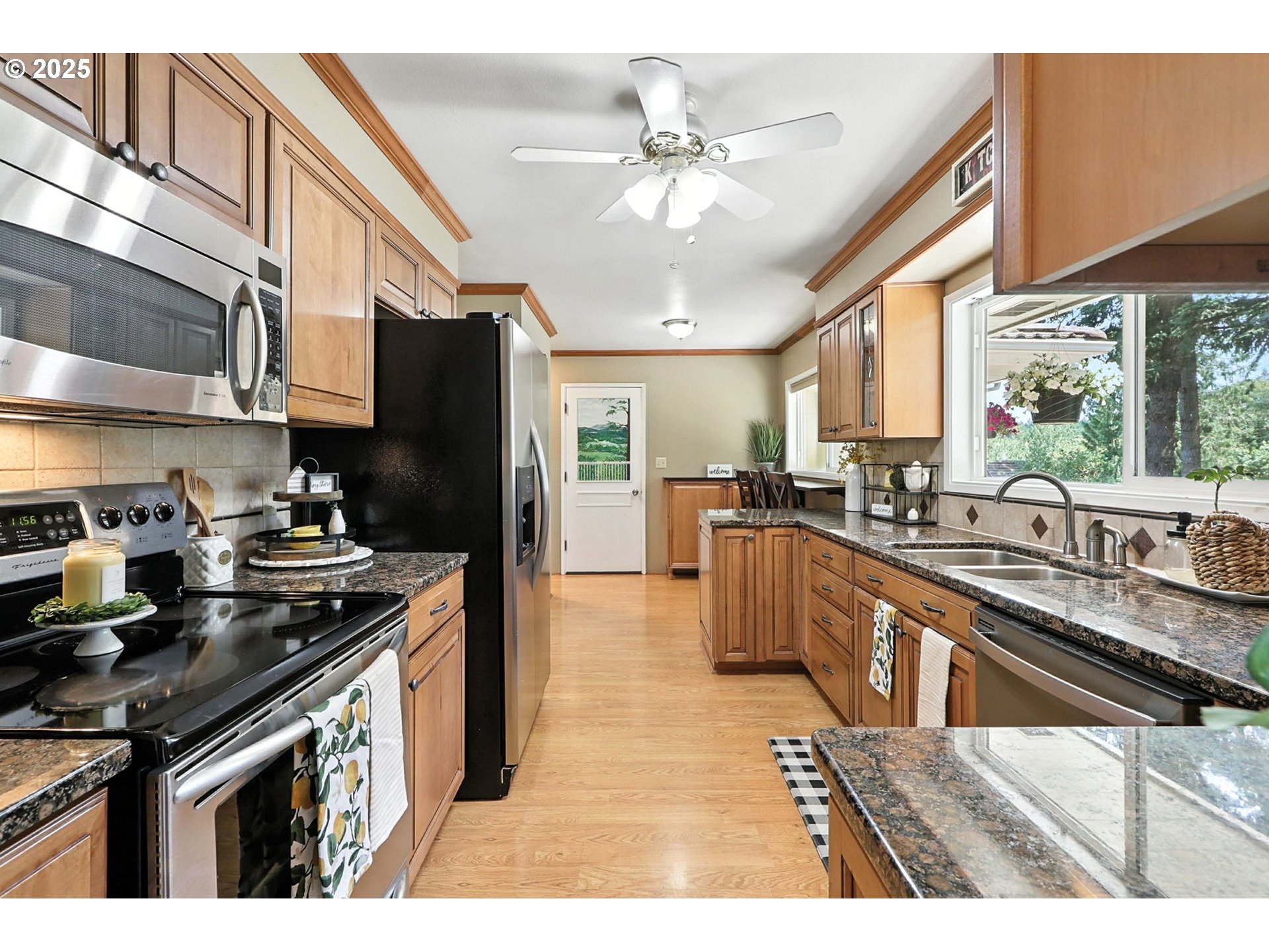 30083 Southeast Cemetery Road Estacada, OR 97023 - Photo 4 of 28 a kitchen with stainless steel appliances granite countertop a sink a stove a refrigerator cabinets and a dining table