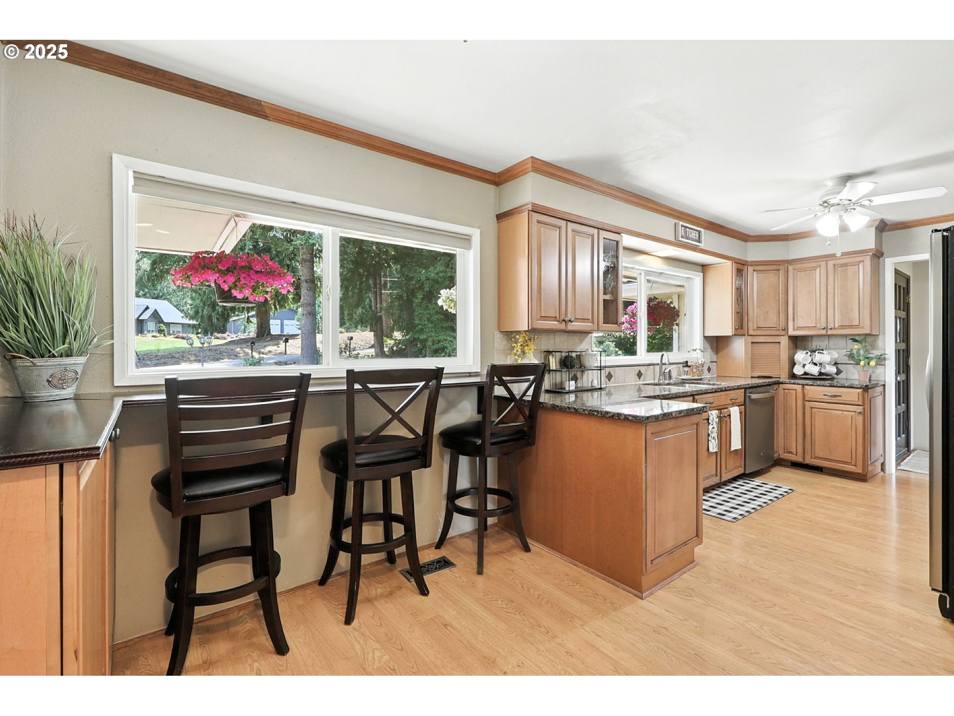 30083 Southeast Cemetery Road Estacada, OR 97023 - Photo 6 of 28 a kitchen with a refrigerator and a dining table