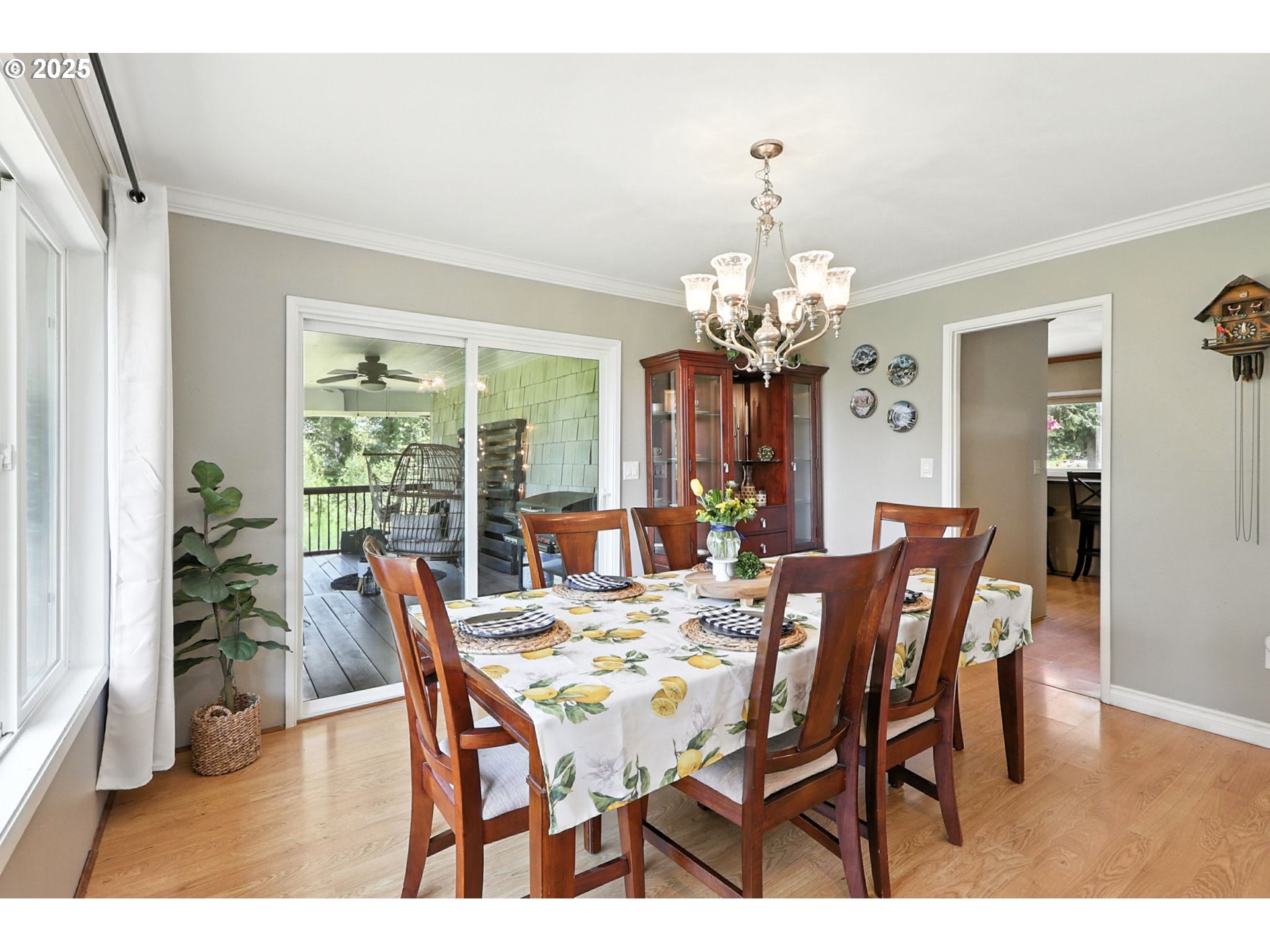 30083 Southeast Cemetery Road Estacada, OR 97023 - Photo 8 of 28 a view of a dining room with furniture a chandelier and wooden floor