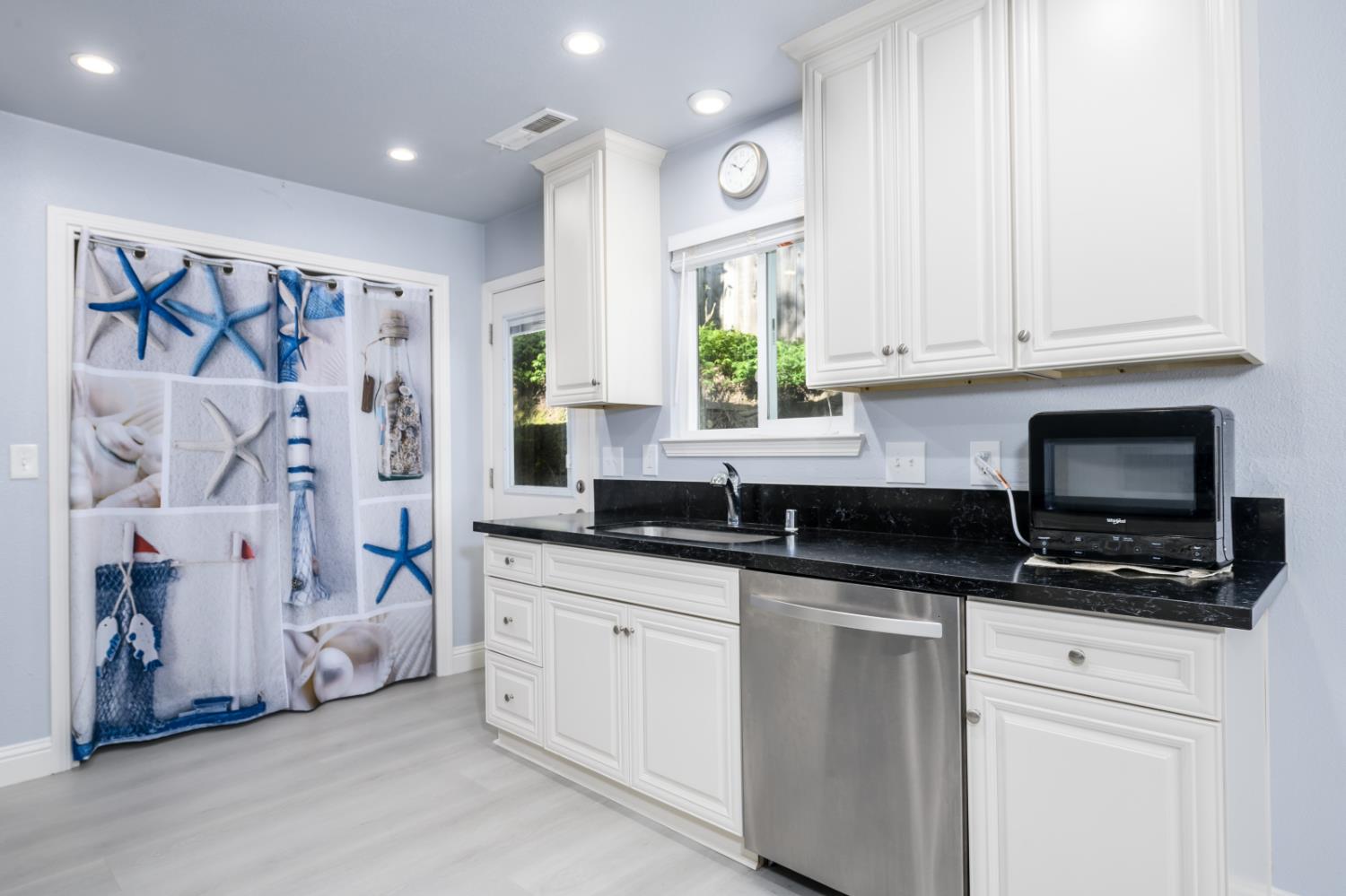 2873 Anderson Way Placerville, CA 95667 - Photo 10 of 24 a kitchen with stainless steel appliances granite countertop a sink a stove and a microwave