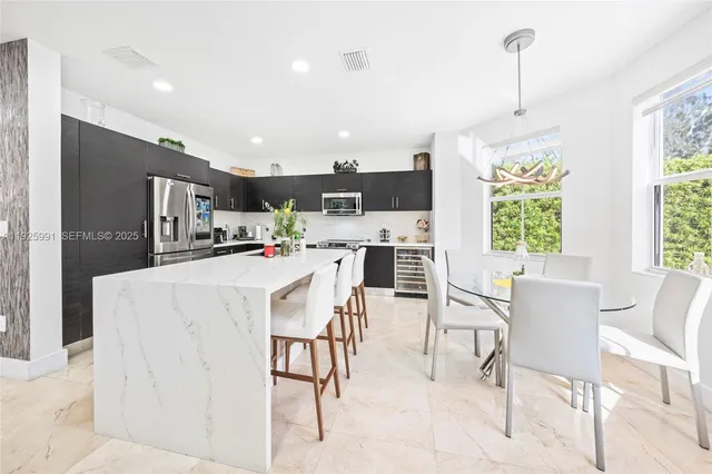 a living room with furniture and flowers