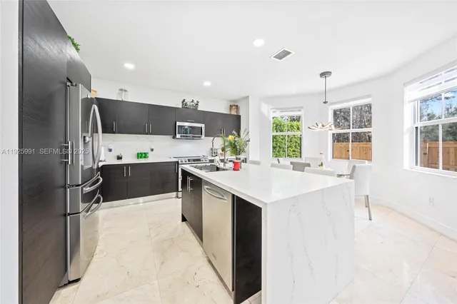 a large white bed in a white room