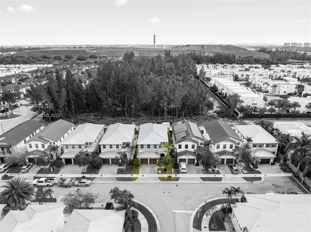 a large bathroom with a large tub sink vanity and granite