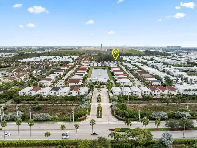a large bathroom with a sink a vanity a large mirror and a bathtub