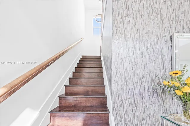 a spacious bedroom with a large bed and a flat screen tv