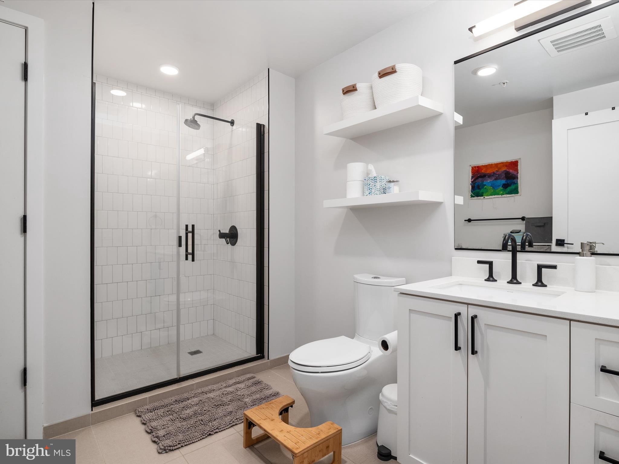 1211 Van Street Southeast, Unit 1110 Washington, DC 20003 - Photo 29 of 46 a bathroom with a sink toilet and shower