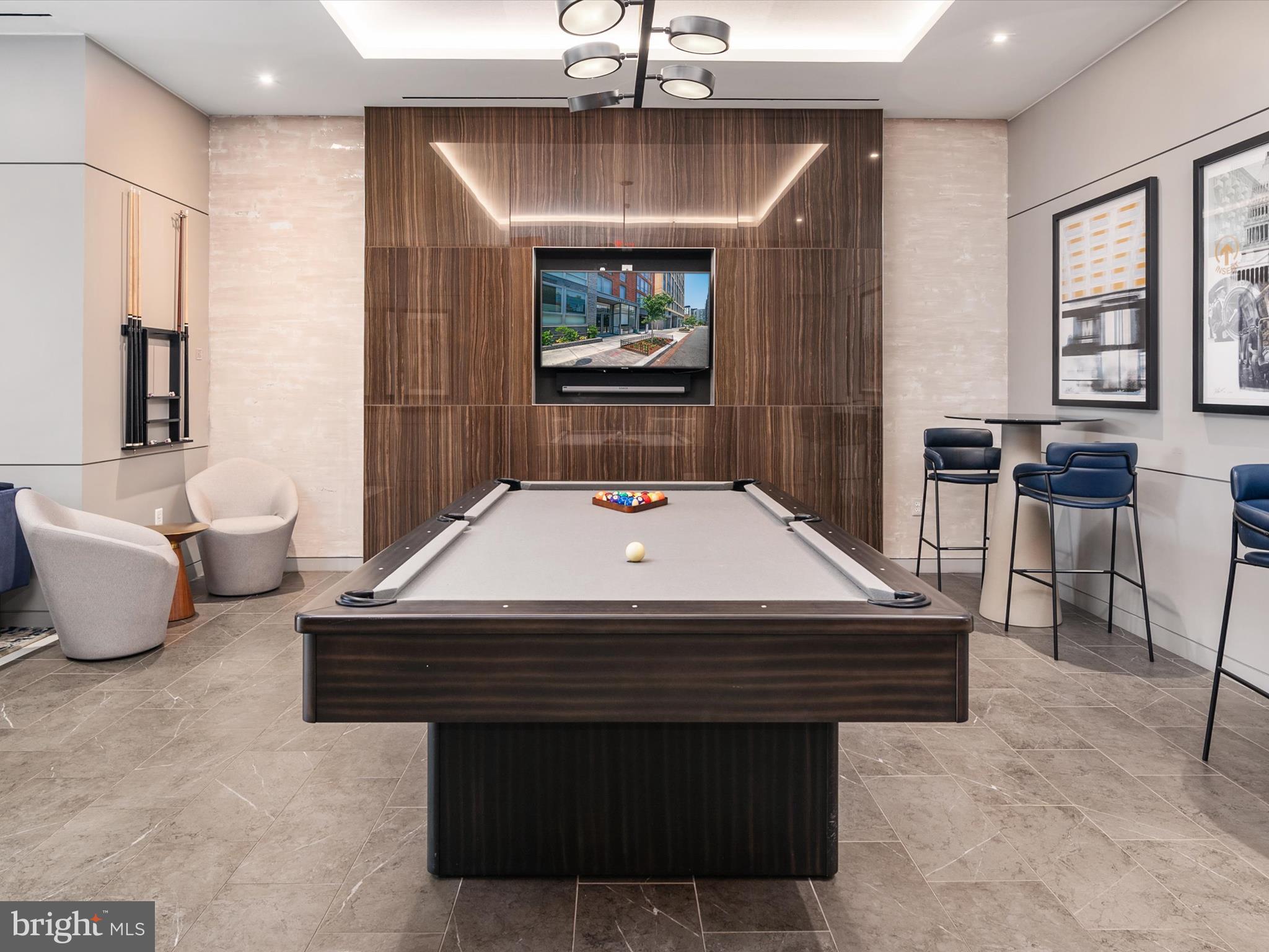 1211 Van Street Southeast, Unit 1110 Washington, DC 20003 - Photo 36 of 46 a room with pool table and windows