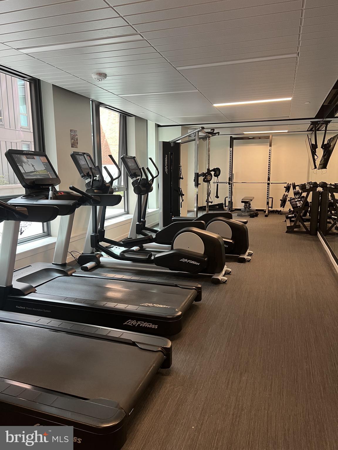 1211 Van Street Southeast, Unit 1110 Washington, DC 20003 - Photo 4 of 46 a view of a room with gym equipment