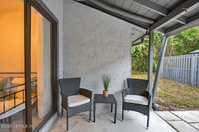 a bedroom with bed and wooden floor