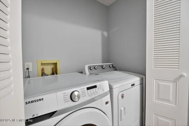 an aerial view of a house with a garden and a sitting area