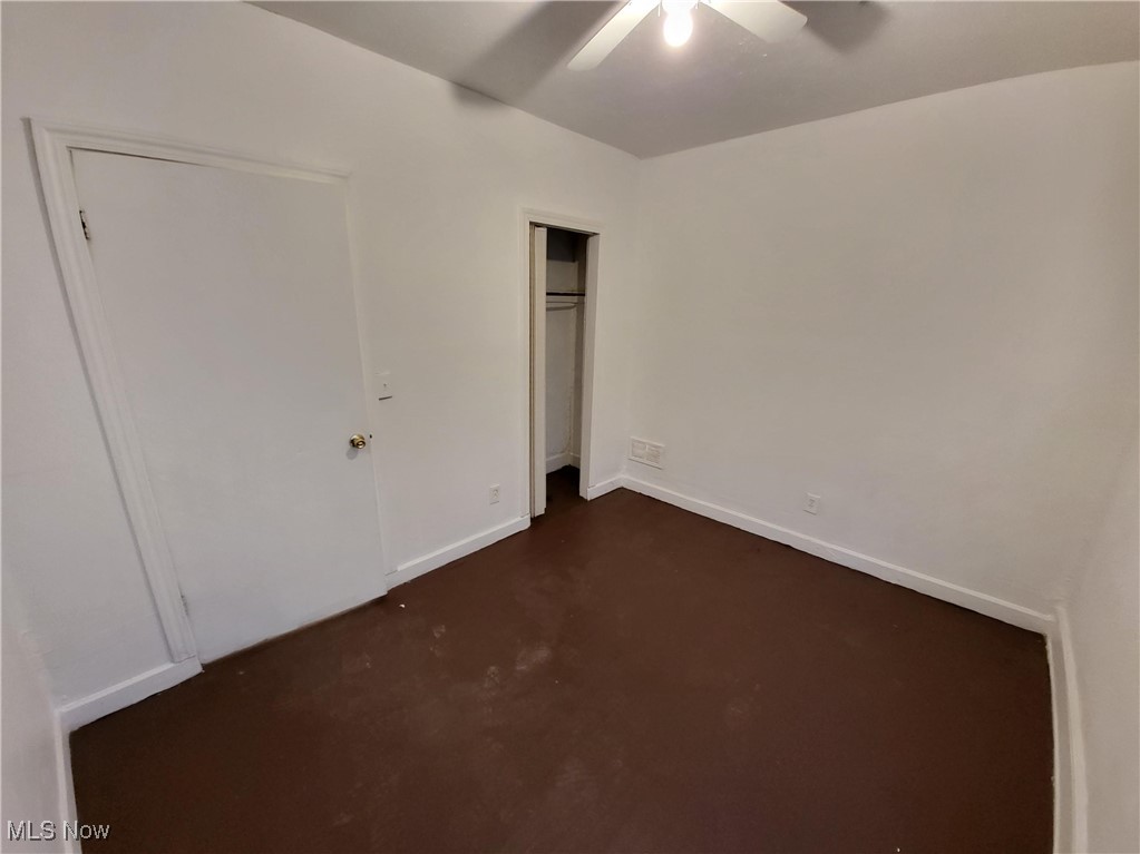1825 Lakeview Road Cleveland, OH 44112 - Photo 18 of 19 Unfurnished bedroom featuring a closet and a ceiling fan