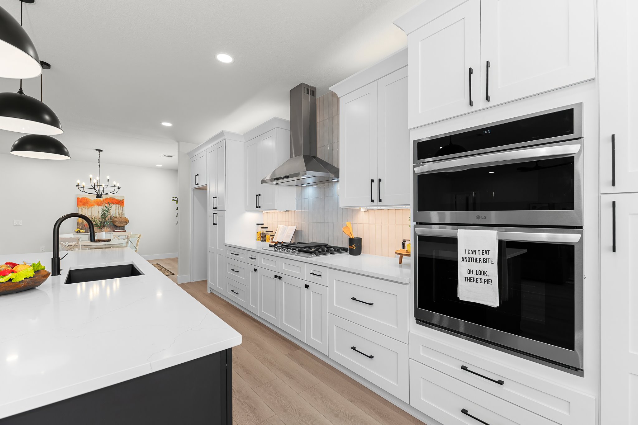 206 Armstrong Drive Georgetown, TX 78633 - Photo 23 of 39 a kitchen with stainless steel appliances a stove microwave and cabinets