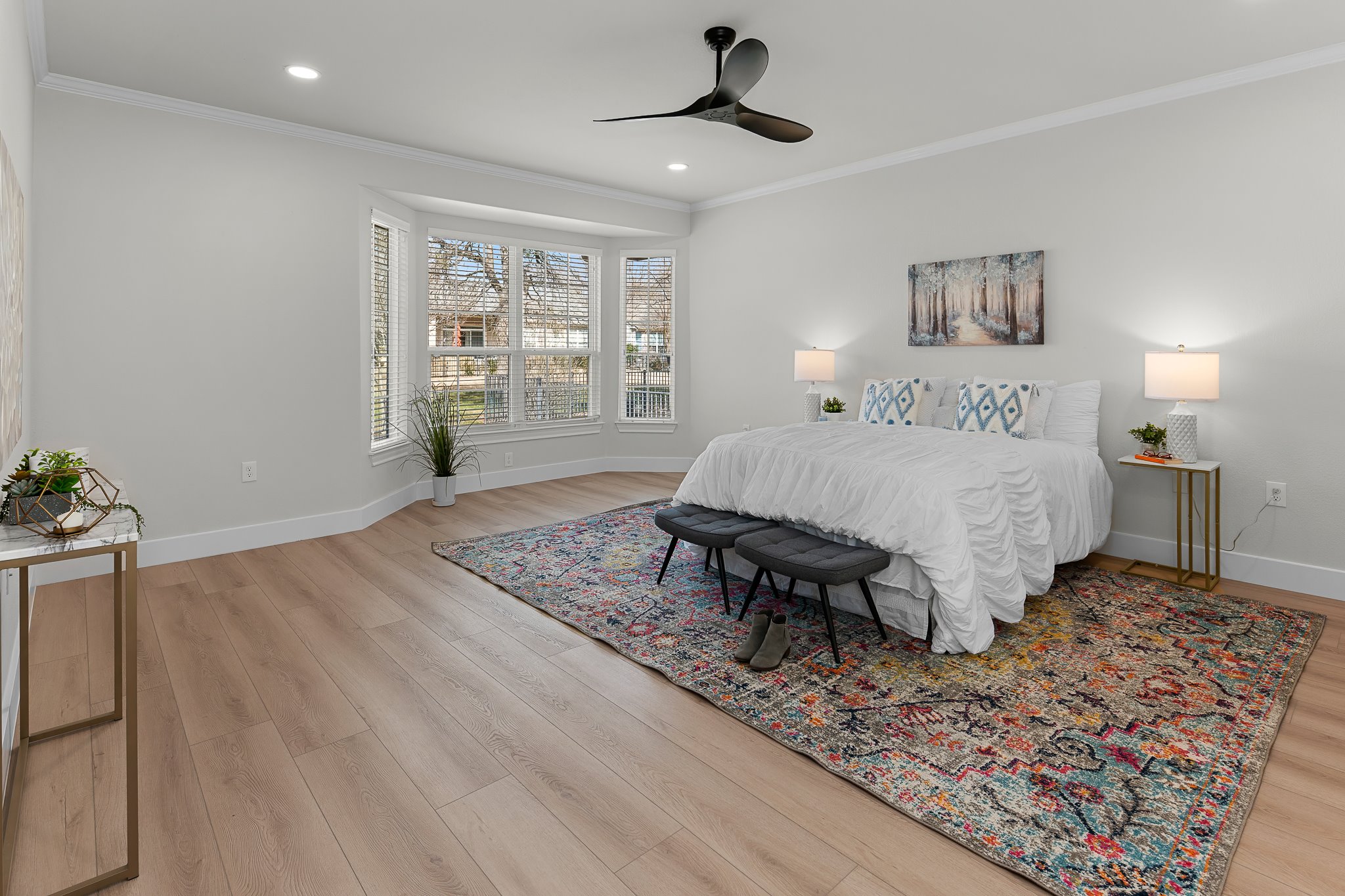 206 Armstrong Drive Georgetown, TX 78633 - Photo 6 of 39 a spacious bedroom with a bed a chandelier and window