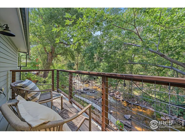 a view of a two chairs in the balcony