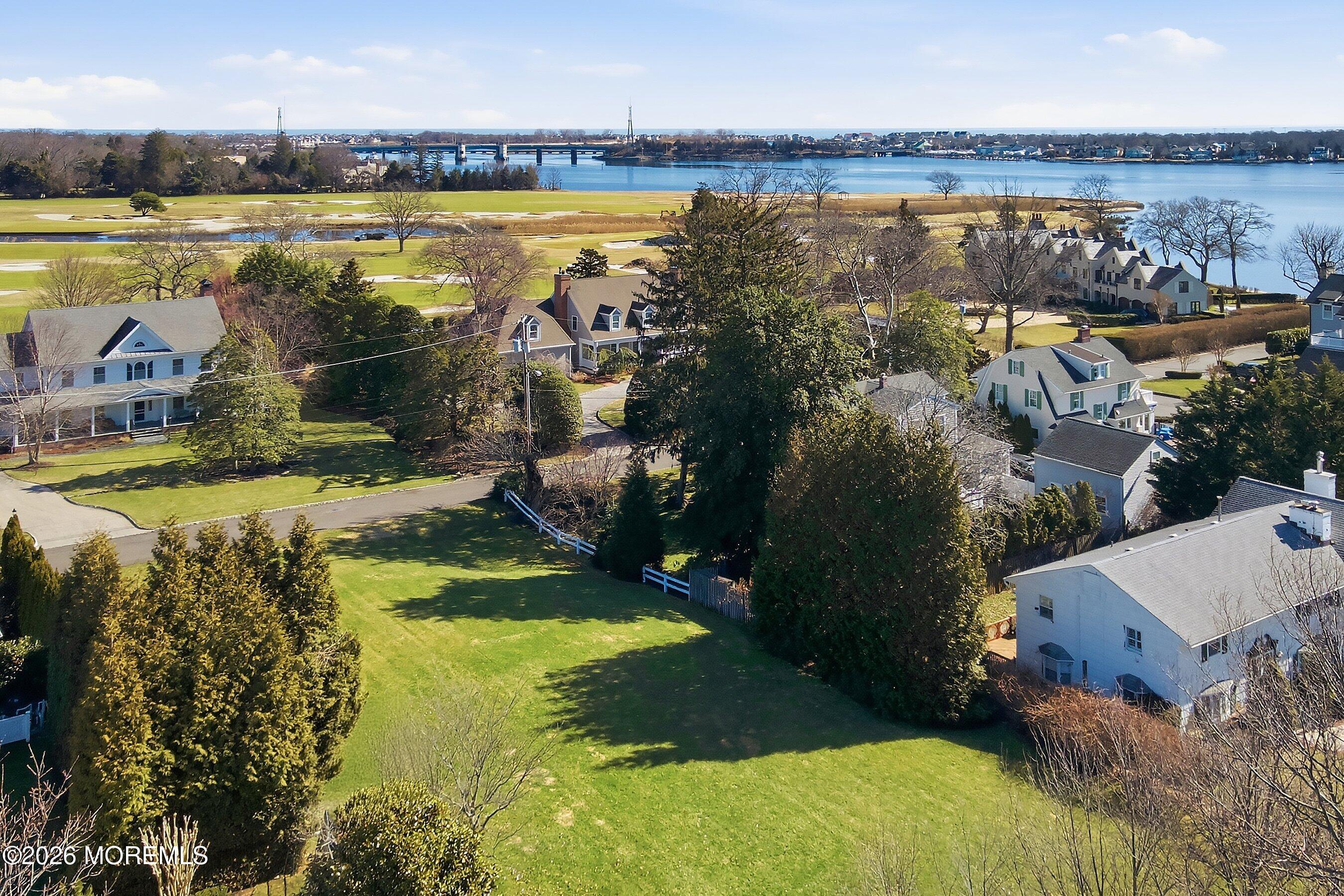 409 Laurel Avenue Brielle, NJ 08730 - Photo 16 of 17 a view of a lake with a city
