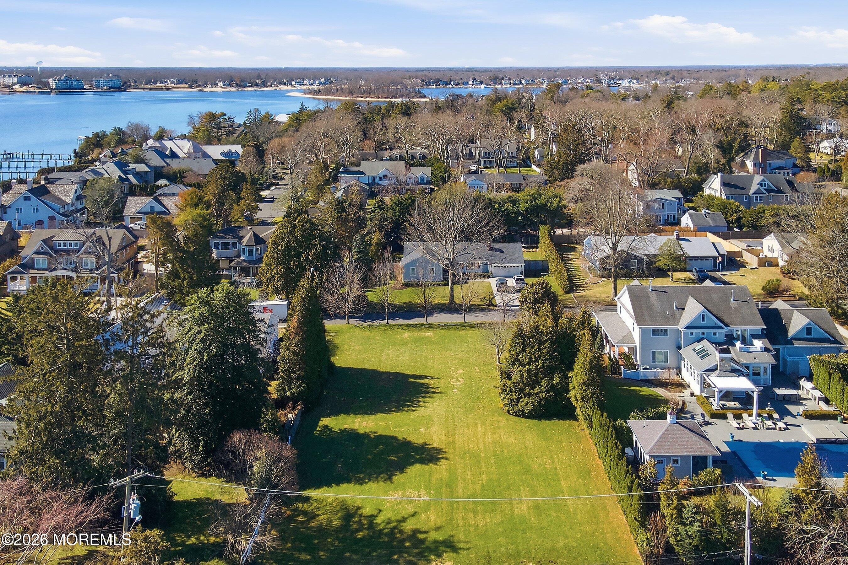 409 Laurel Avenue Brielle, NJ 08730 - Photo 2 of 17 an aerial view of residential houses with outdoor space
