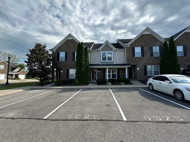 a front view of a house with yard