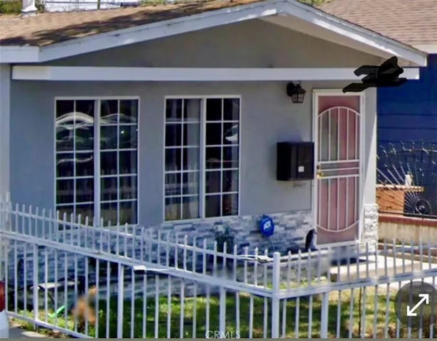 a front view of a house with a glass door