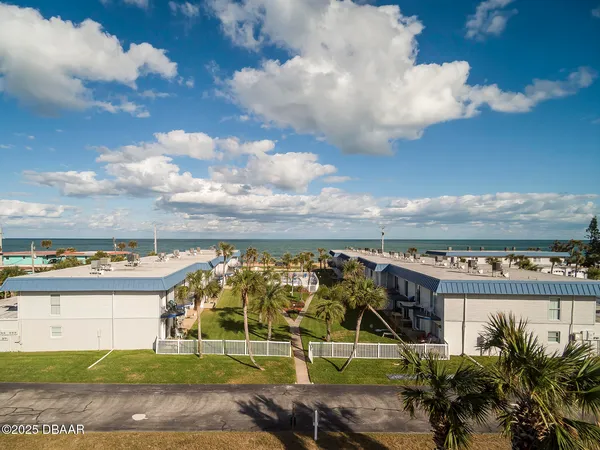 an outdoor space with lots of green space