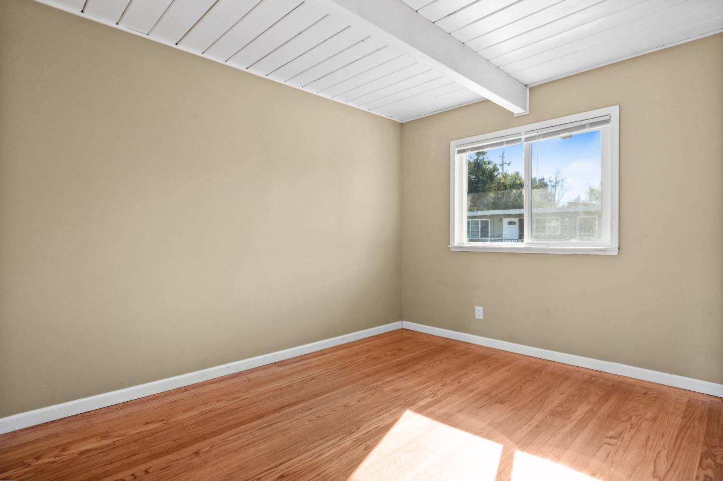 4 Coleman Place Menlo Park, CA 94025 - Photo 12 of 34 a view of a big room with wooden floor and a window