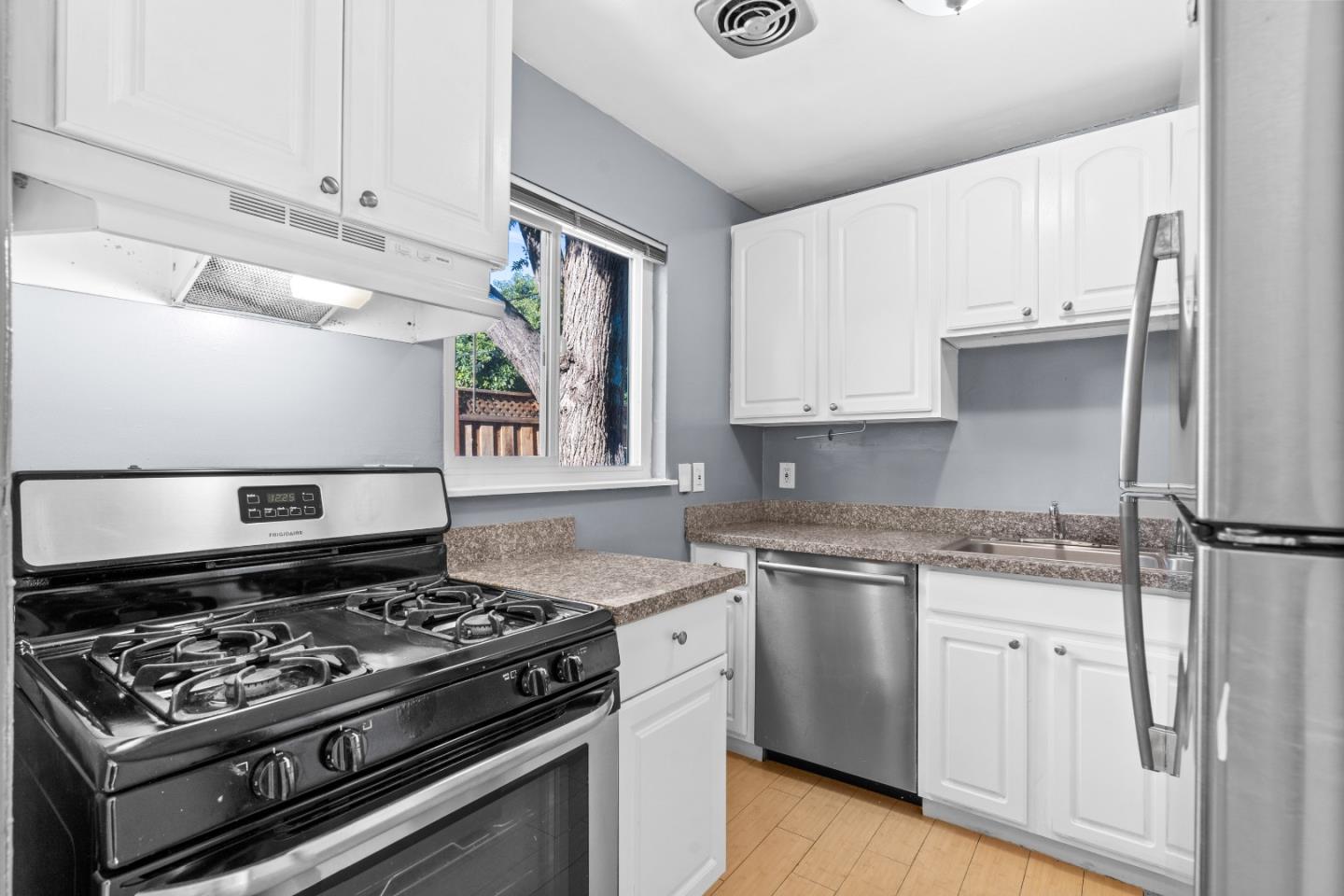 4 Coleman Place Menlo Park, CA 94025 - Photo 14 of 34 a white stove top oven sitting inside of a kitchen
