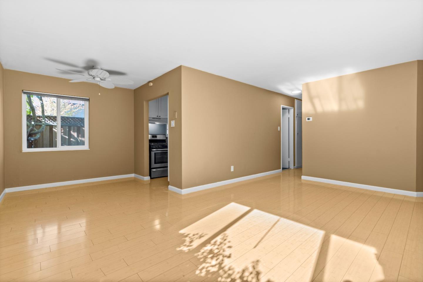 4 Coleman Place Menlo Park, CA 94025 - Photo 16 of 34 a view of an empty room with window and wooden floor