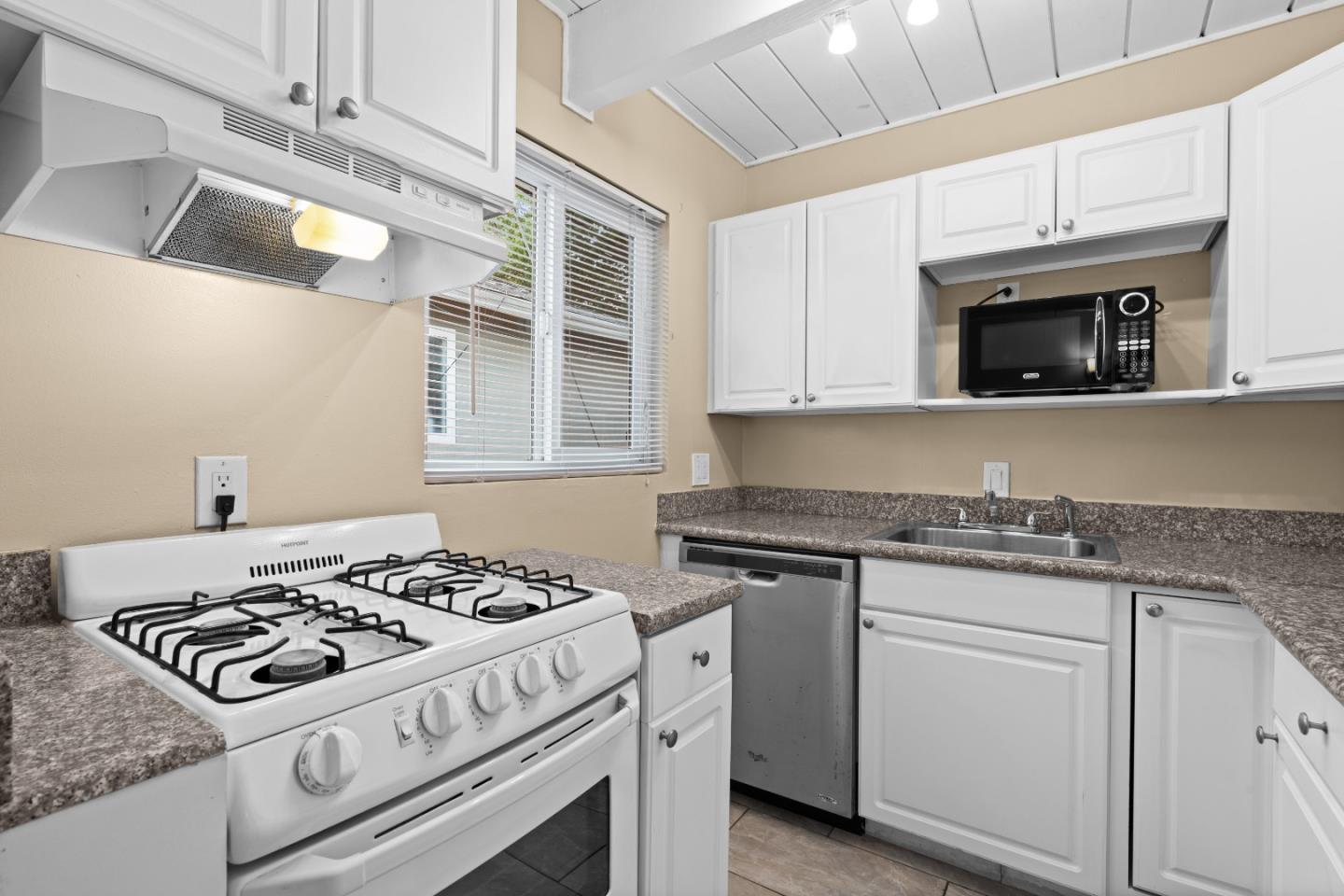 4 Coleman Place Menlo Park, CA 94025 - Photo 21 of 34 a white stove top oven sitting inside of a kitchen