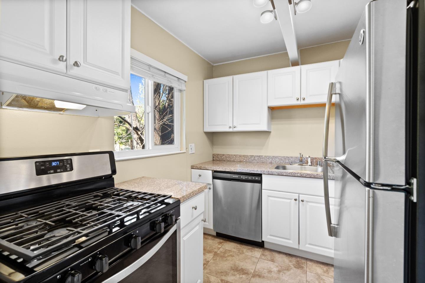 4 Coleman Place Menlo Park, CA 94025 - Photo 24 of 34 a kitchen with white cabinets and appliances